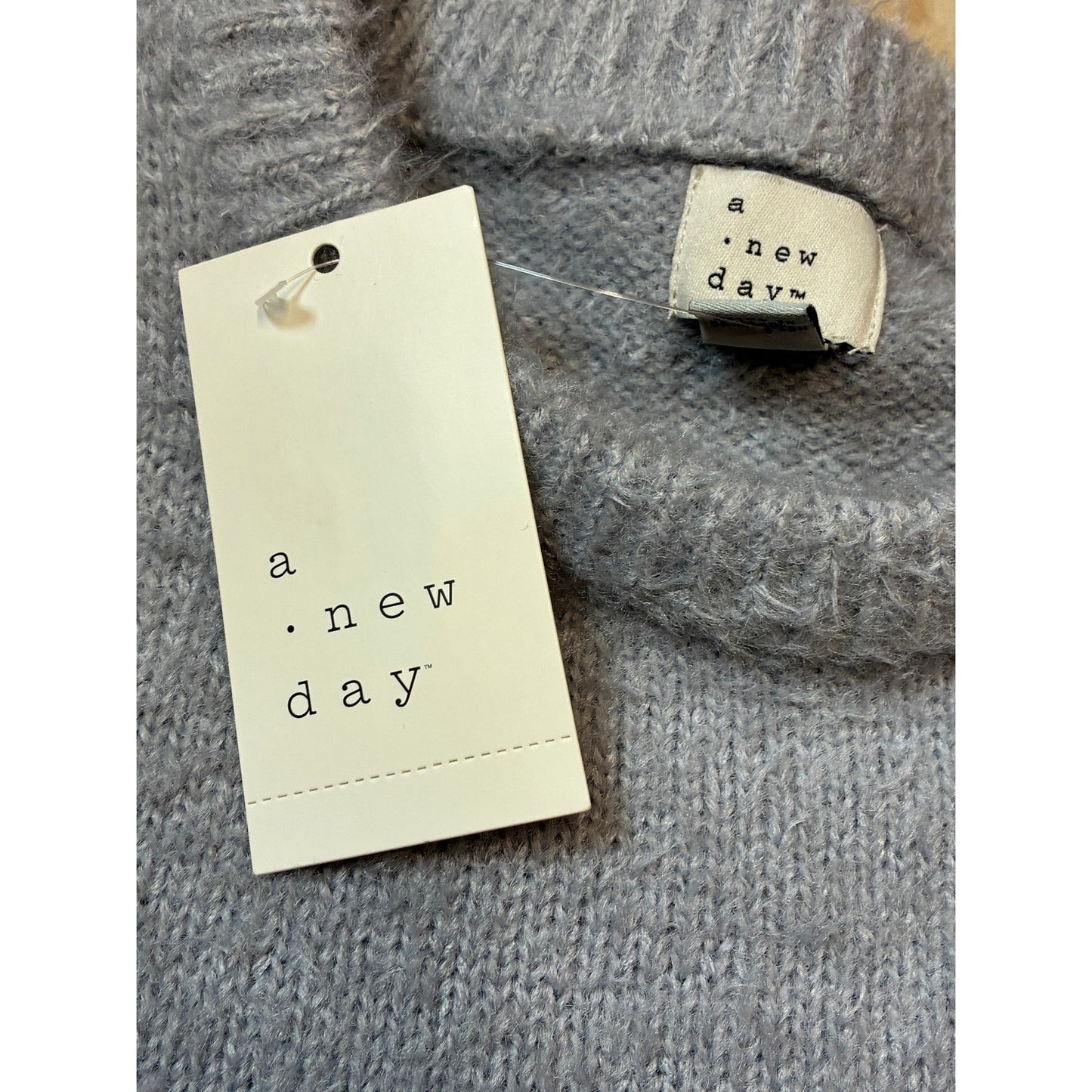 A New Day Women’s Long Sleeve Fuzzy Pullover Sweater With White Stripes On It