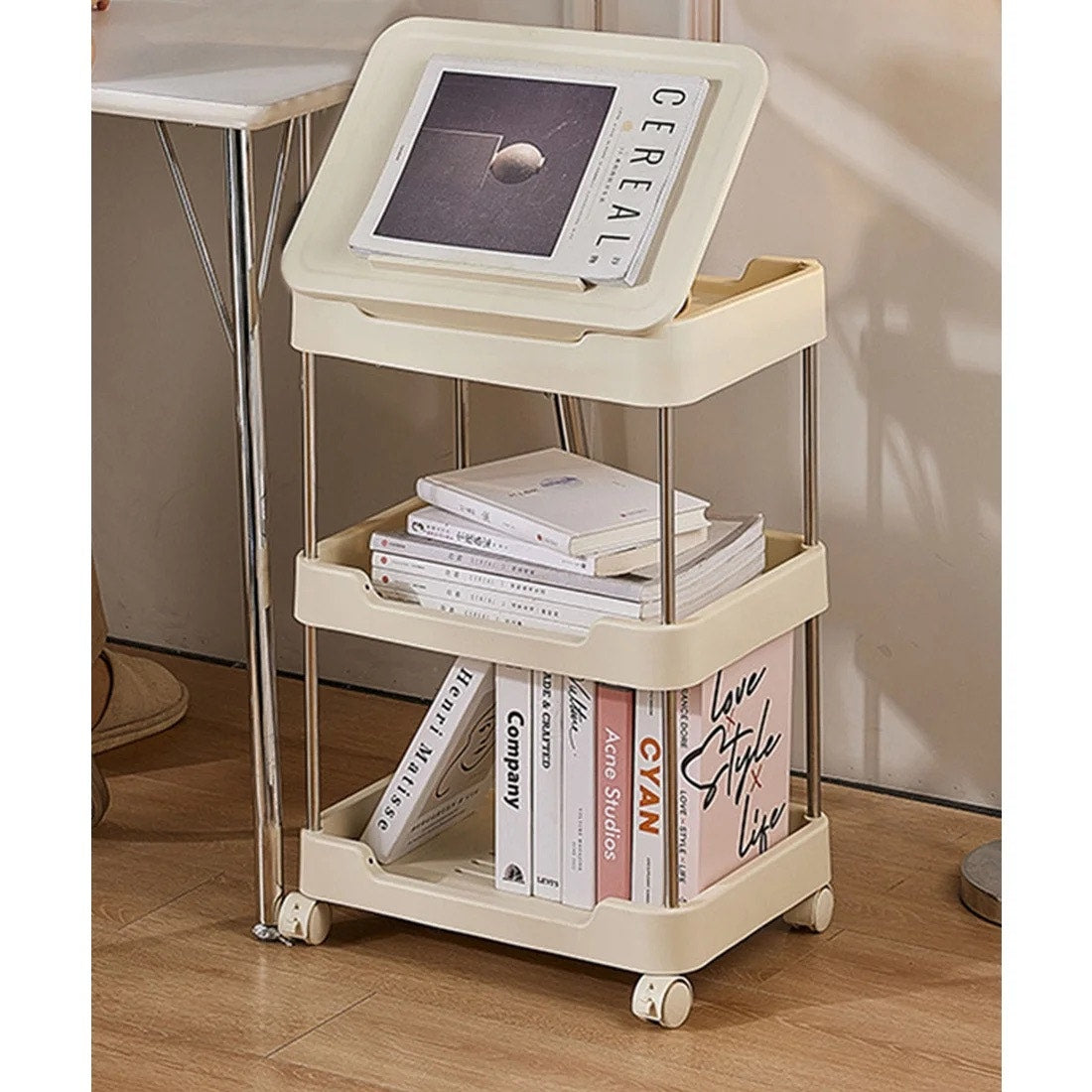 3-tier rolling utility cart with a top handle and drawer feature.
