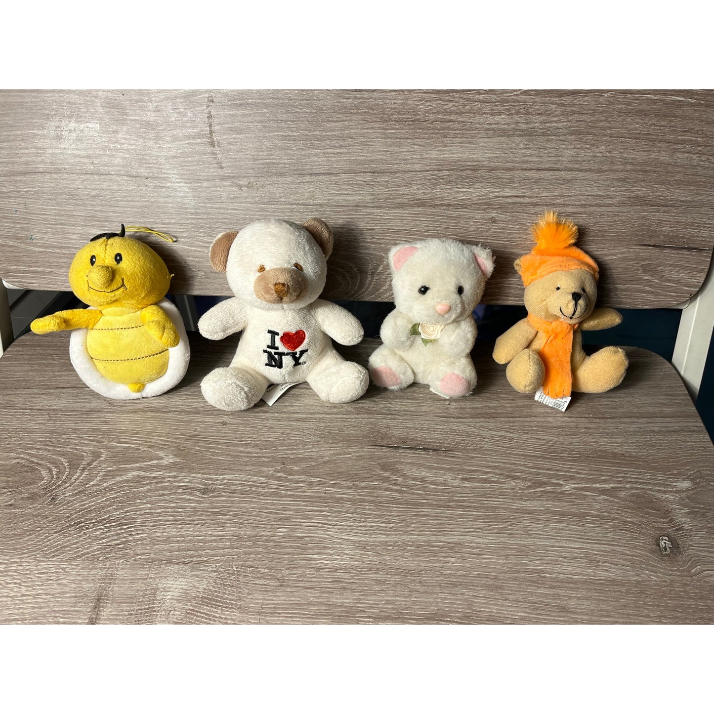 A bundle of four stuffed animals 4 inches