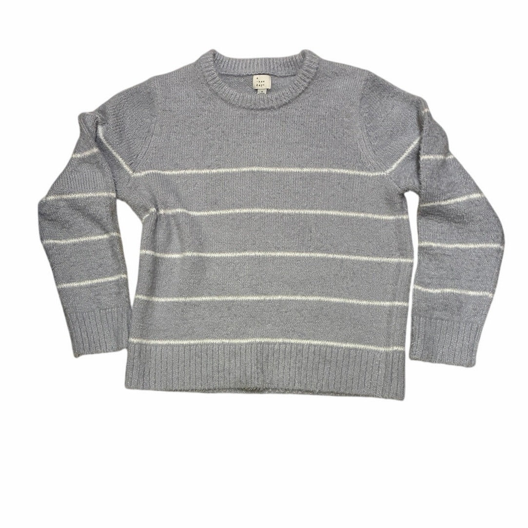 A New Day Women’s Long Sleeve Fuzzy Pullover Sweater With White Stripes On It