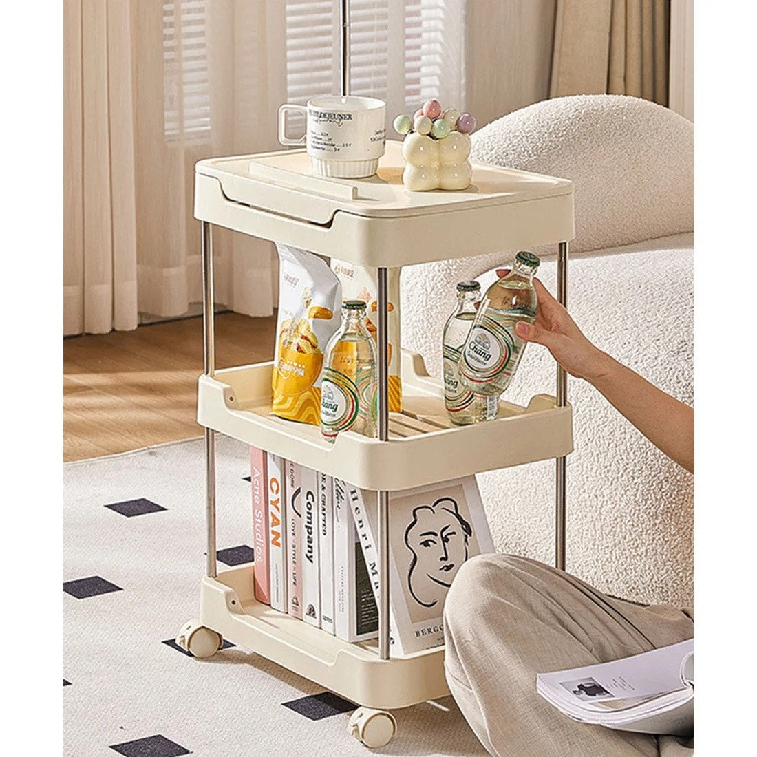 3-tier rolling utility cart with a top handle and drawer feature.