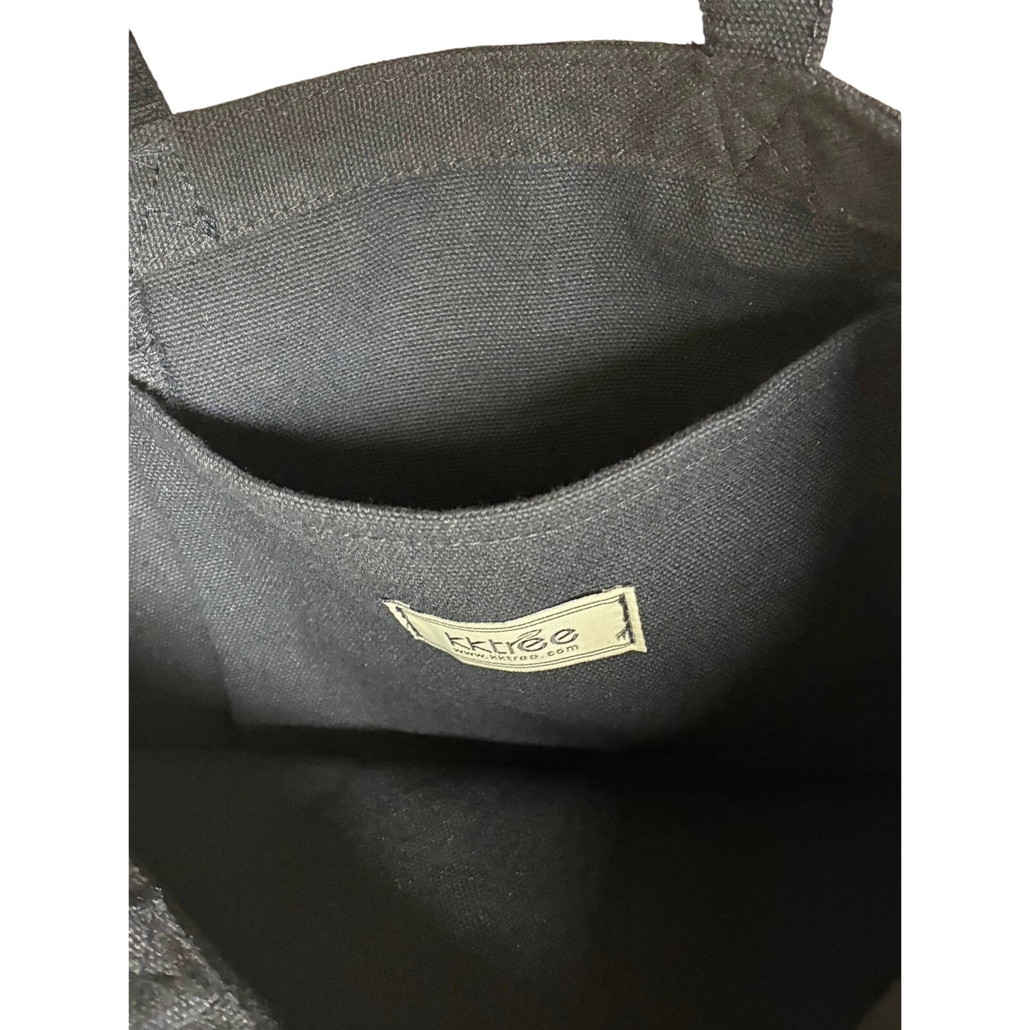 black tote bag featuring an artistic graphic print 13” W X 17” L
