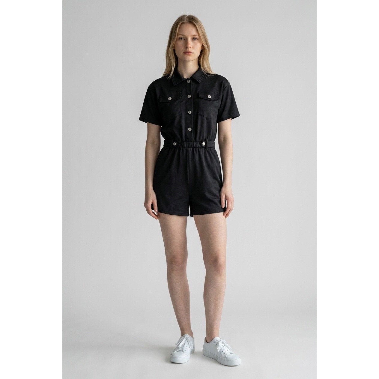 black button-down romper features utility-inspired chest pockets Size Small