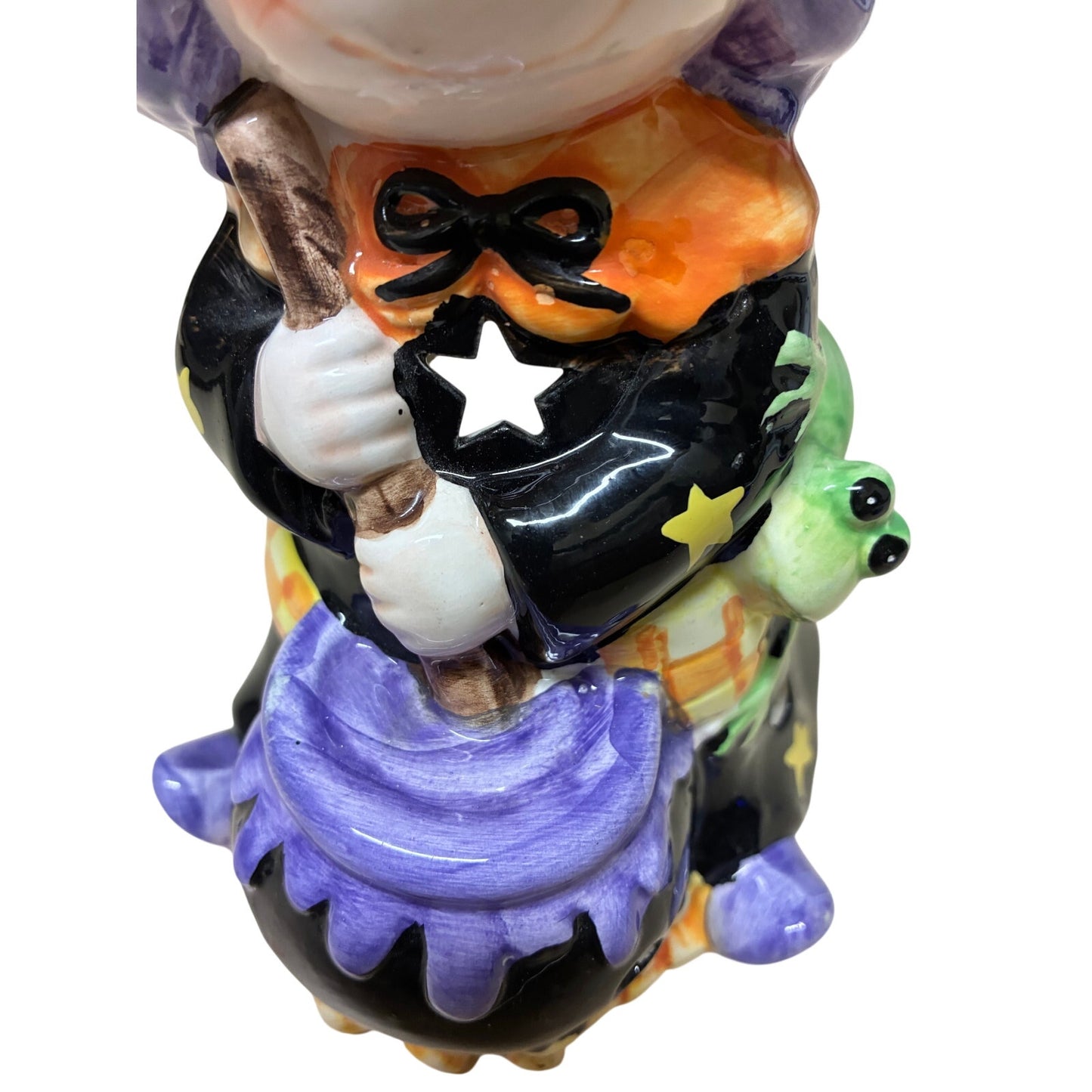 vintage-style ceramic Halloween figurine featuring a witch holding a broom