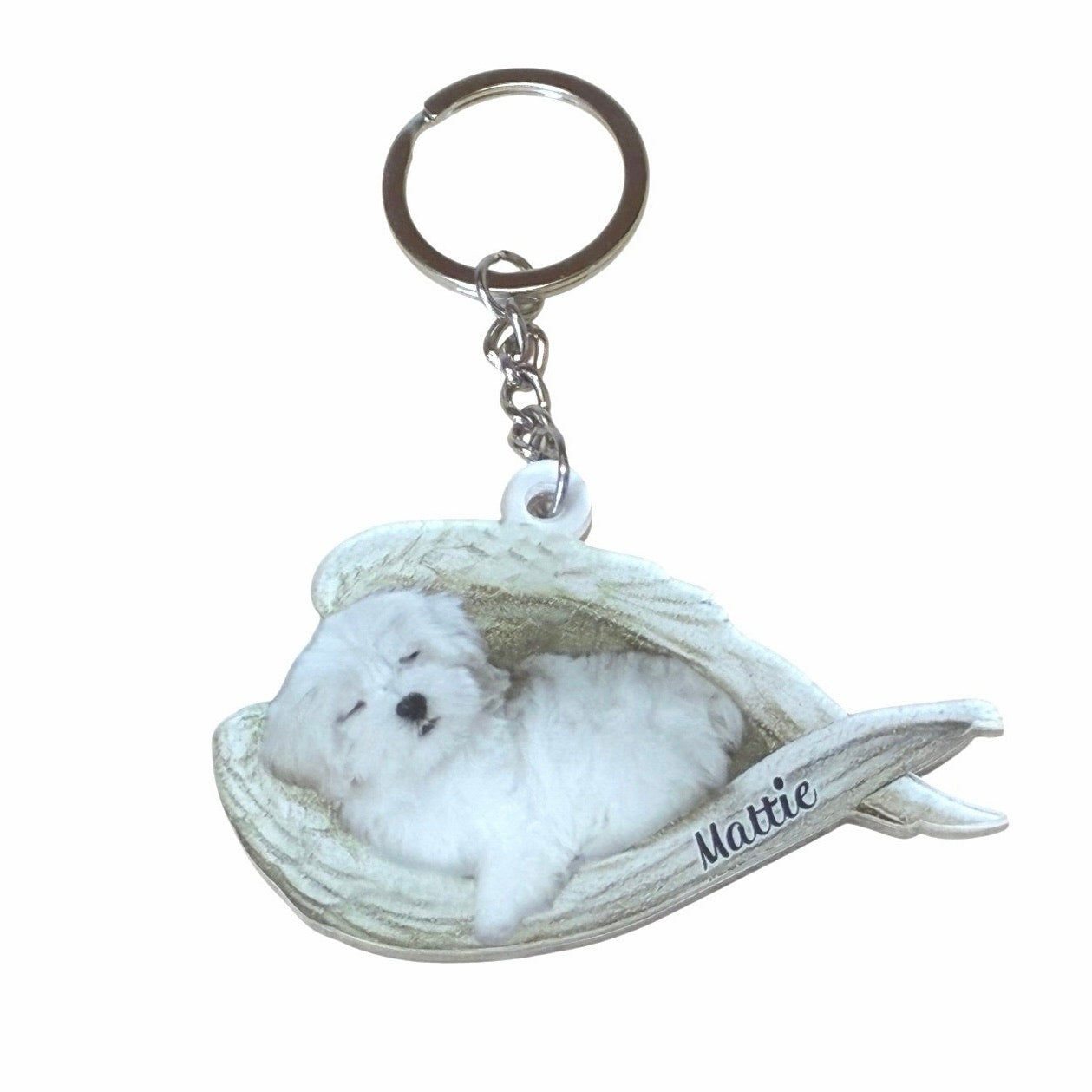 Maltese Sleeping Angel acrylic keychain With The Name Mattie On It