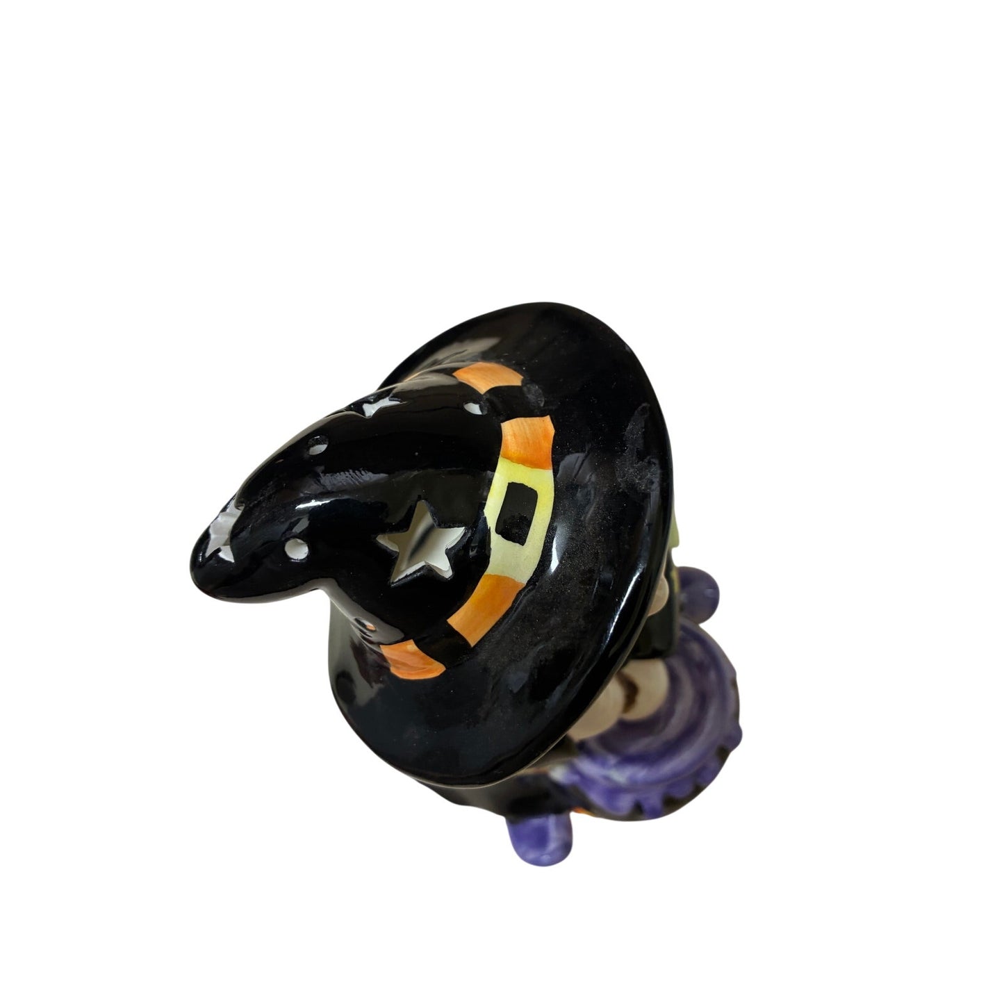 vintage-style ceramic Halloween figurine featuring a witch holding a broom